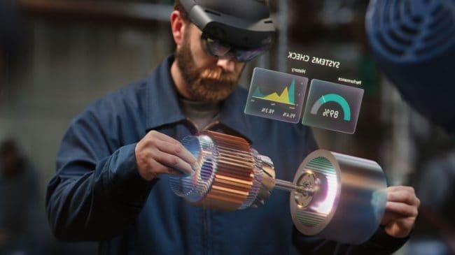 man wearing hololens to fix industrial motor