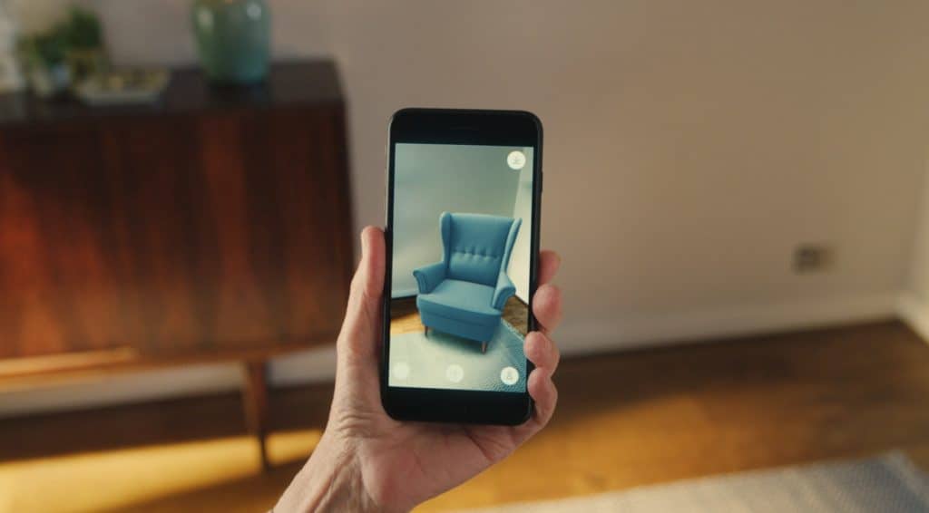 iPhone showing augmented reality furniture mobile app